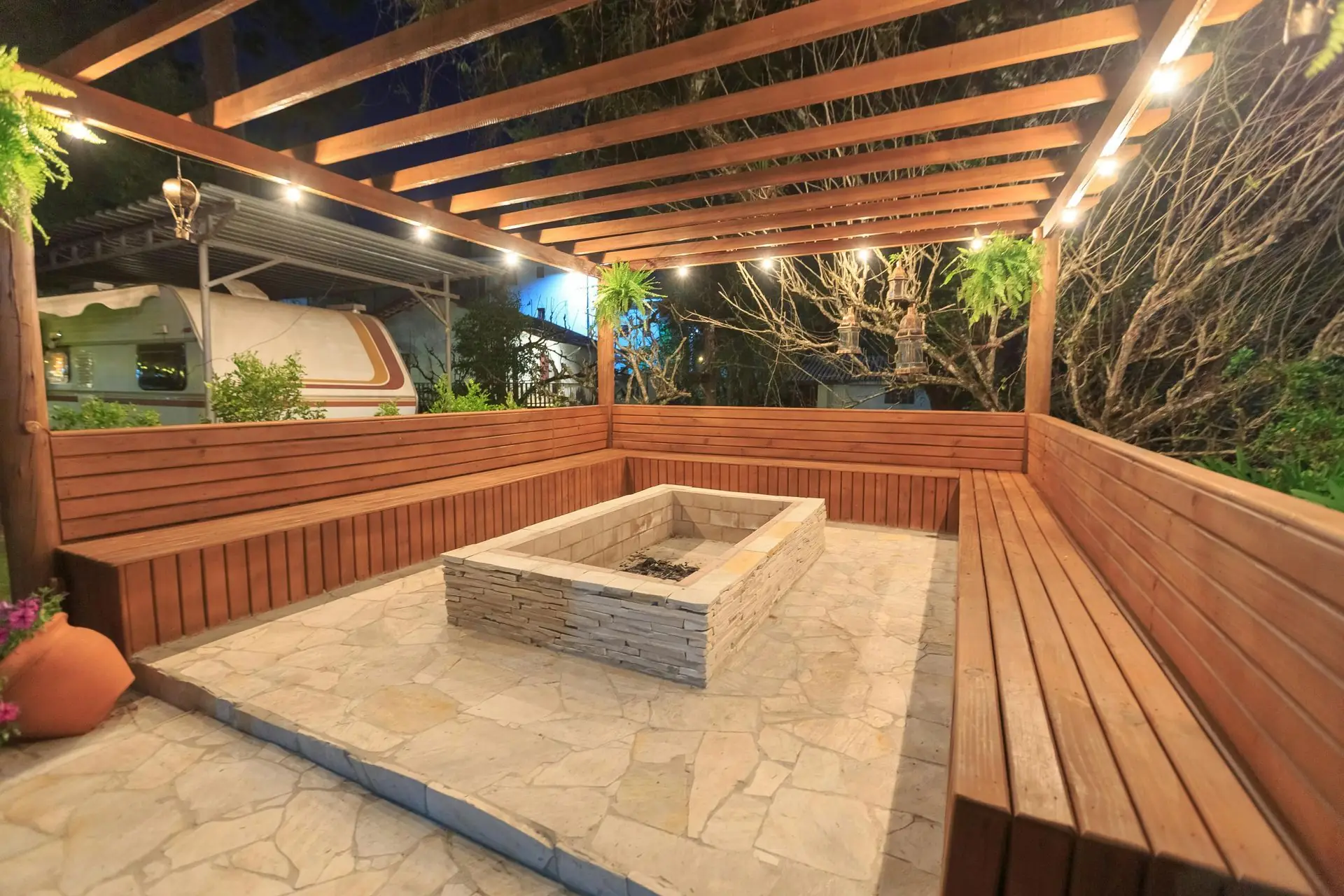 Uplit live oak canopy over a South Miami mid-century home with subtle path lighting.